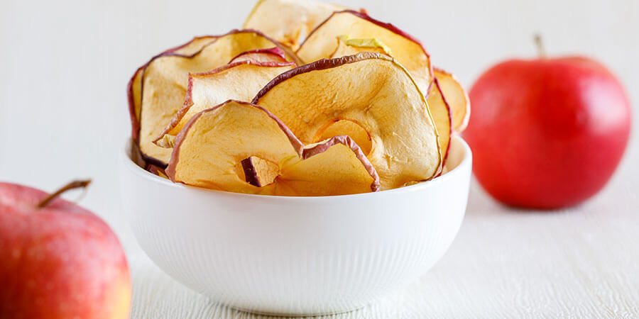 Dehydrated apples served in white contemporary bowl
