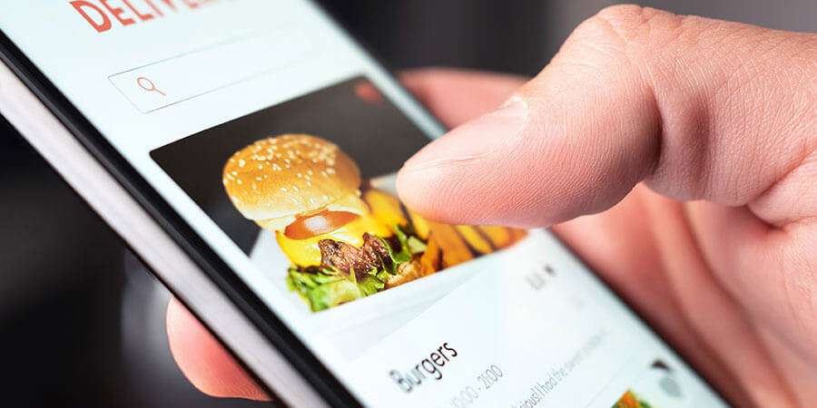 Smartphone Displaying Picture of Hamburger 900x450